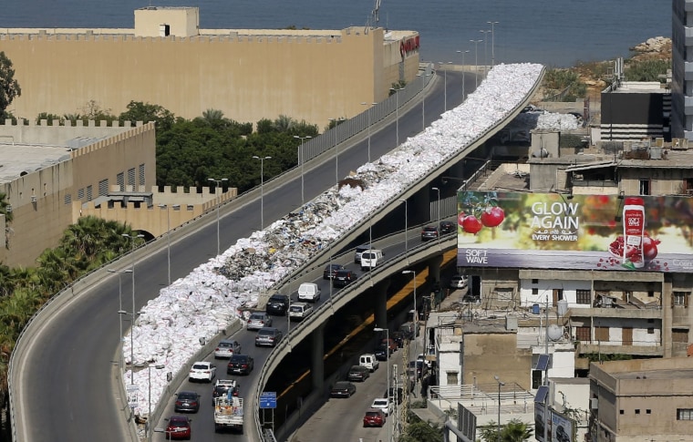 Image: Piles of garbage cover the side of the road in the Jdeideh neighborhood, north of Beirut