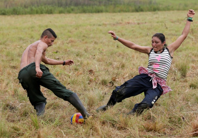 Image: Fighters from Revolutionary Armed Forces of Colombia (FARC) play soccer at a camp where they prepare to ratify a peace deal with the government, near El Diamante in Yari Plains, Colombia