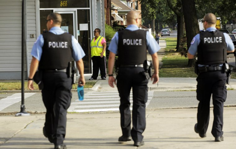 Police patrol a neighborhood in Chicago in 2013.