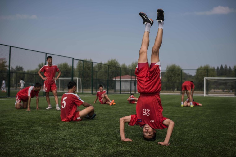 Image: Students of the Pyongyang International Football School take part in an under-14 training session