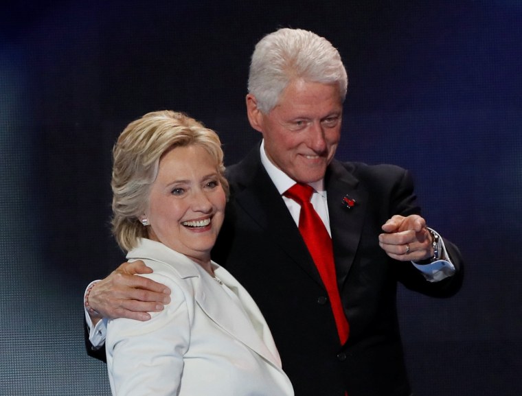 Image: Democratic presidential nominee Hillary Clinton stands with her husband Bill Clinton after accepting the nomination on the final night of the Democratic National Convention in Philadelphia
