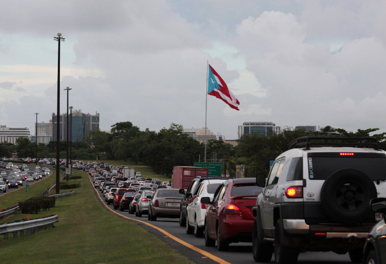 Image: Cars are pictured in a traffic jam as traffic lights were down during a power outage that affected several areas in the country, in San Juan