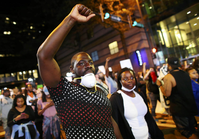 Image: Protesters walk in the streets downtown during another night of protests over the police shooting of Keith Scott in Charlotte
