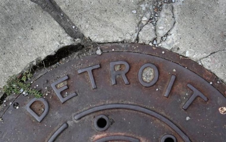 'Detroit' is seen on the top of an iron man-hole cover on a street in Detroit