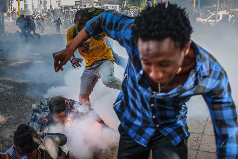 Image: Students are injured by a police grenade during a protest in Johannesburg