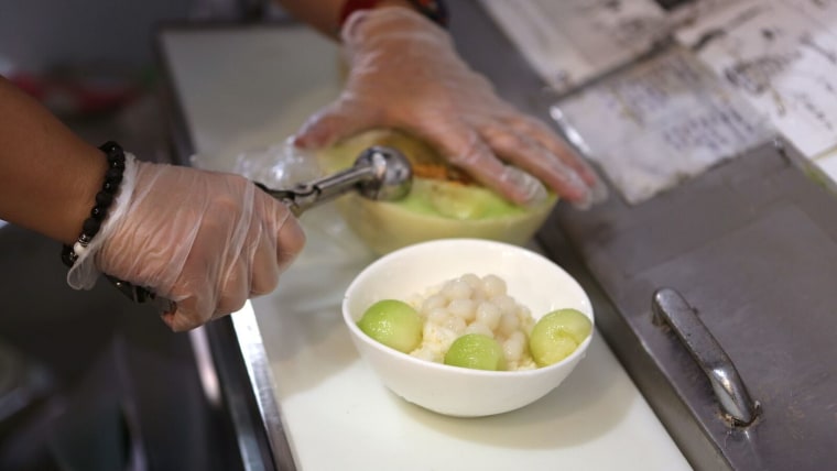 Frozen melon balls on ice cream