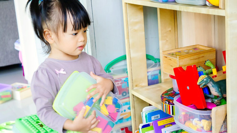 little girl with toys