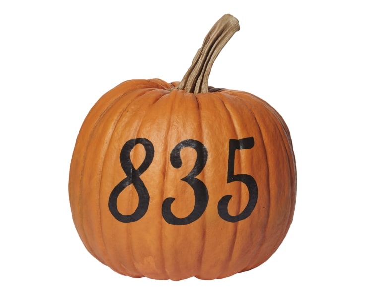 Let trick-or-treaters know where they are with this DIY numbered pumpkin.