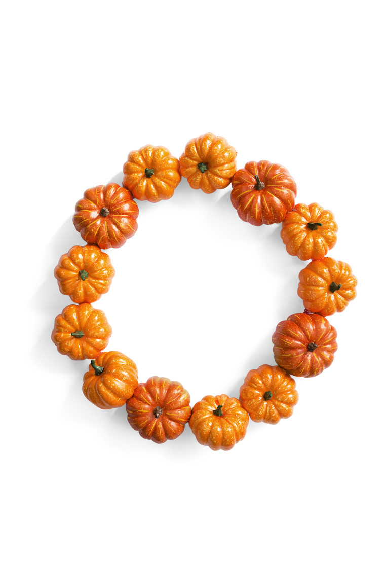 Make your front door festive with this pumpkin wreath.