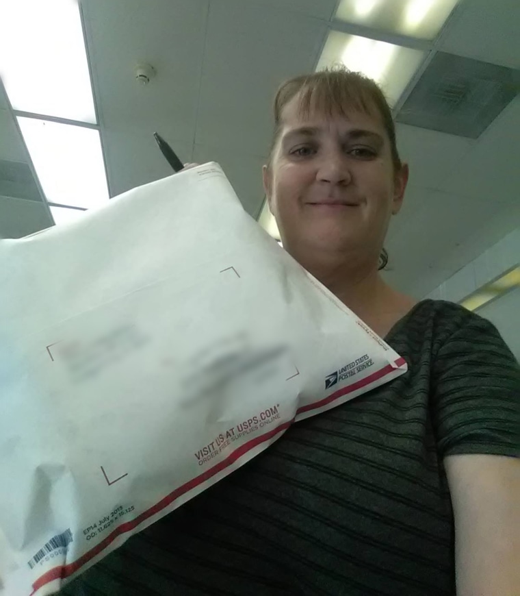 Slatten prepares to mail a package containing the replacement blanket to Parker.