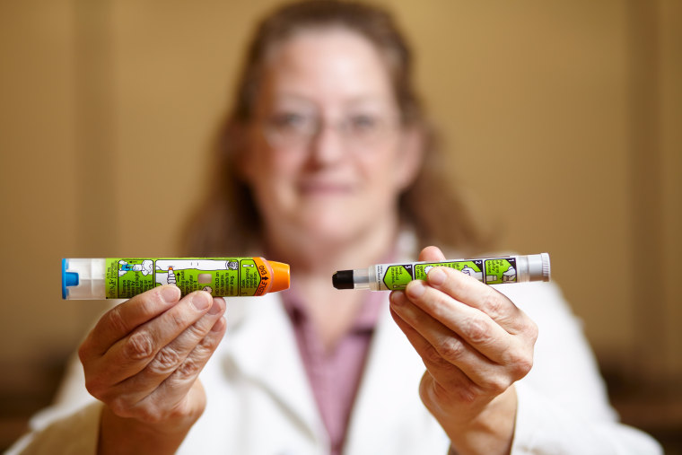 Image: Dr. Julie C. Brown of University of Washington Medicine pediatrics/emergency medicine holding EpiPens, the new design (left) and old EpiPen (right), Monday, Sept. 19, 2016, Seattle, Washington.