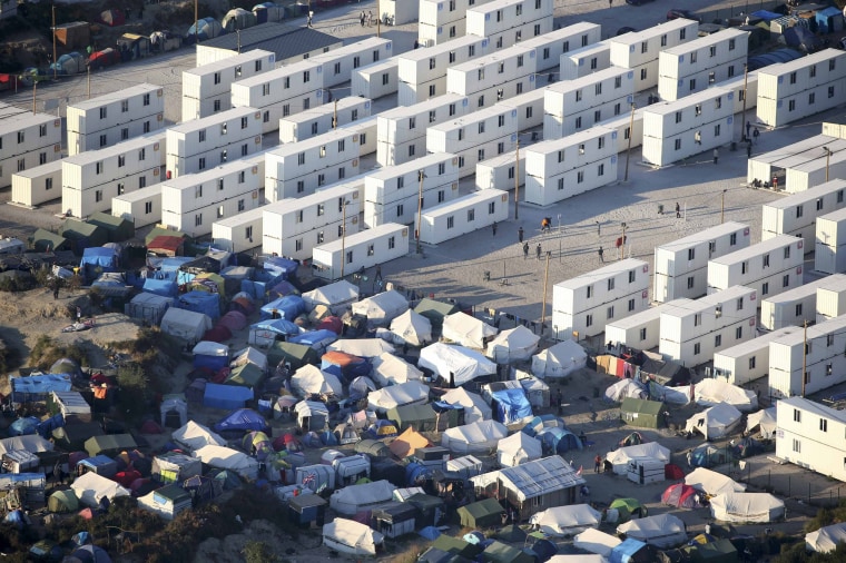 Image: An aerial view shows "The Jungle" in Calais, France