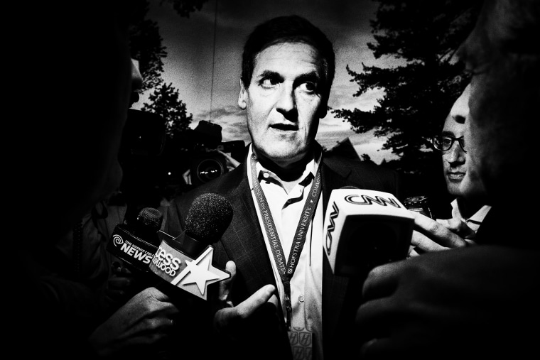 Mark Cuban talks to a crowd of reporters.