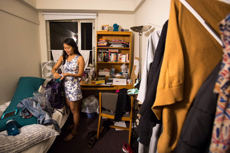 Nadya Okamoto, an 18-year-old freshman at Harvard University, packs her backpack ahead of her 7 p.m. meeting with the Hygiene Campaign Club.