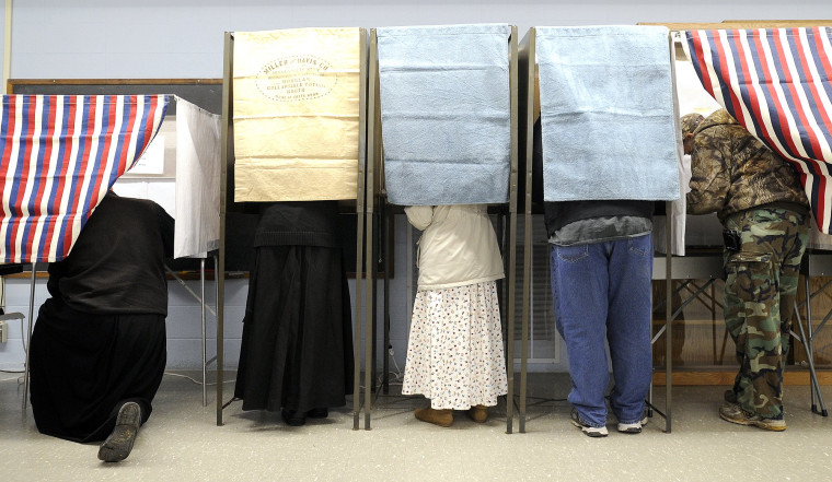 Voters fill the booths voting Tuesday, Nov. 6, 2012, at the Stockton Community Center in Stockton, Minn.