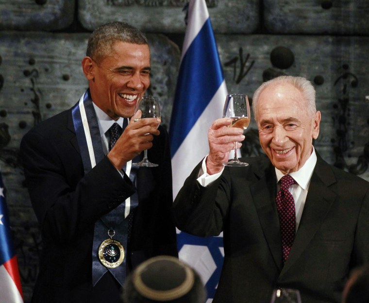 Image: U.S. President Barack Obama toasts with Israel's President Shimon Peres after Obama was presented with the Presidential Medal of Distinction, Israel's highest civilian honor in Jerusalem