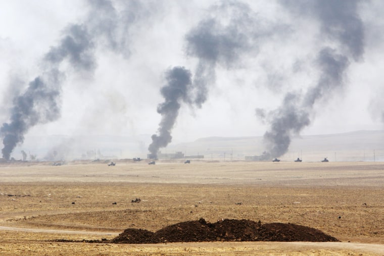 Image: Smoke rises from clashes with Islamic State militants on the southeast of Mosul