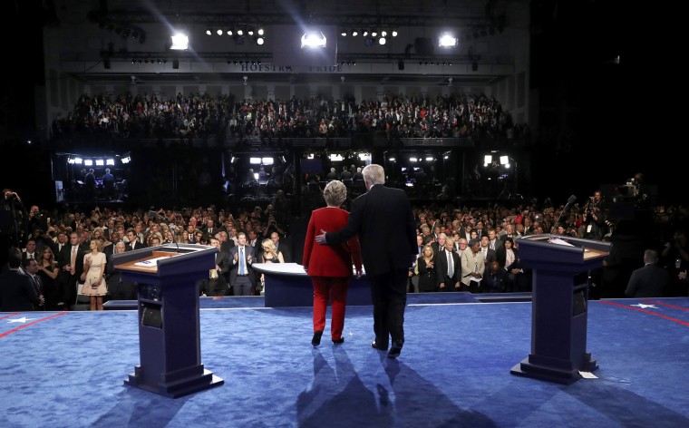Image: Republican U.S. presidential nominee Donald Trump stands with Democratic U.S. presidential nominee Hillary Clinton at the conclusion of their first presidential debate at Hofstra University in Hempstead