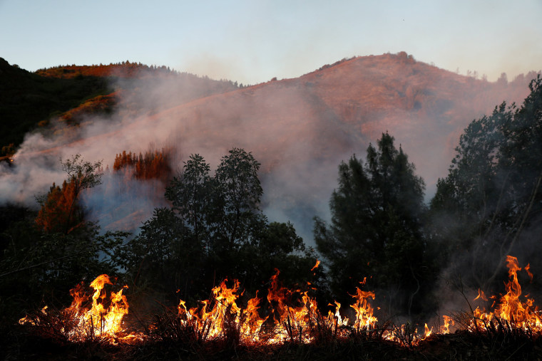 Image: Firefighters battle the Loma Fire near Santa Cruz, California