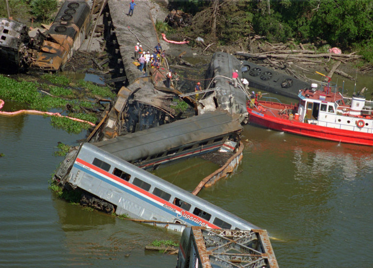 The wreckage of the Amtrak Sunset Limited train lies in the bayou north of Mobile, Alabama, on Sept. 22, 1993. A barge hit a railroad bridge and minutes later the train hit the bent tracks and plunged into the bayou, killing 47 people.