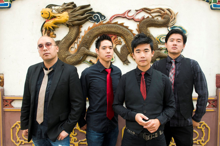 Image: Members of the Portland, Oregon-based Asian-American rock band The Slants pose