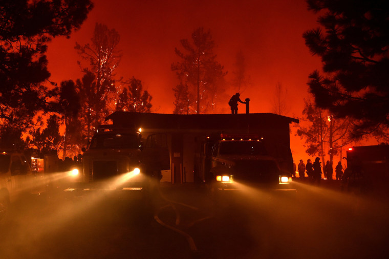 Image: Firefighters attempt to save the Casa Loma fire station in the Santa Cruz Mountains near Loma Prieta, Calif.