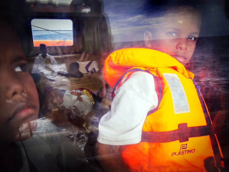 Image: Eight-year-old Samir from Somalia looks out of the window of the Astral rescue ship