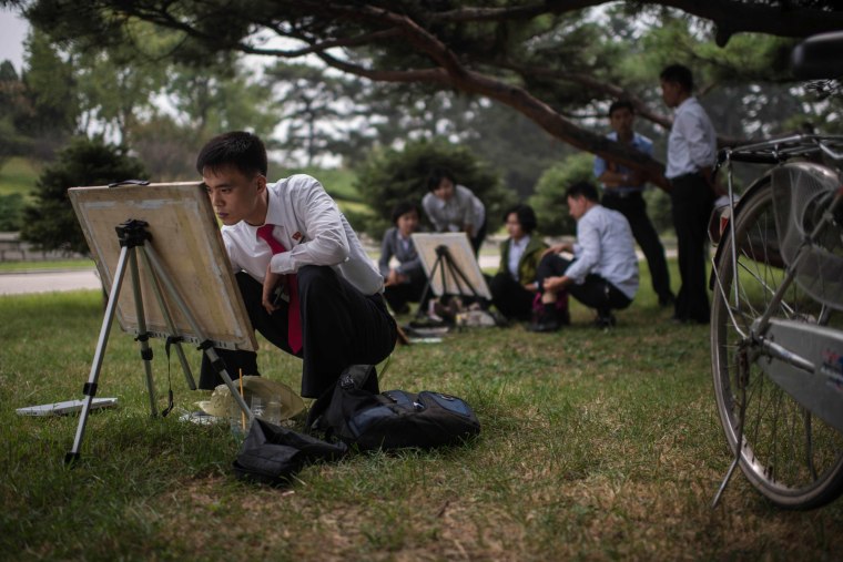 Image: North Korean students take part in a painting workshop in a park in Pyongyang