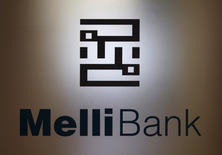 A company logo of Bank Melli is displayed on the glass door at its branch in Hong Kong