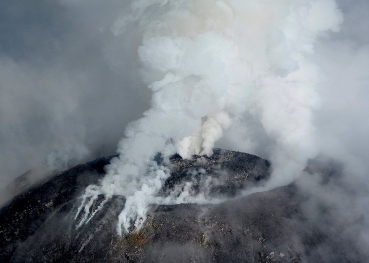 Image: An aerial view shows the crater of the Mexican Colima or "Fire" Volcano spewing gas and ash in this handout photo released to Reuters by Civil Protection of Jalisco