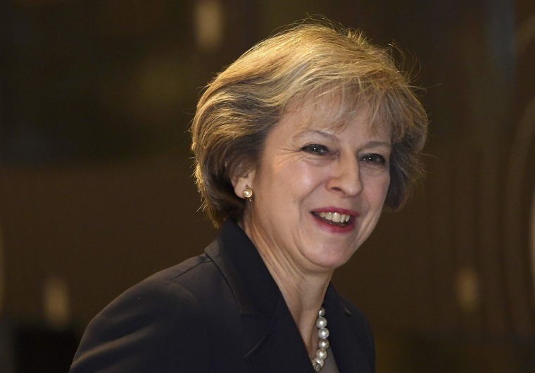 Image: Britain's Prime Minister May arrives at a television studio during the annual Conservative Party Conference in Birmingham, Britain