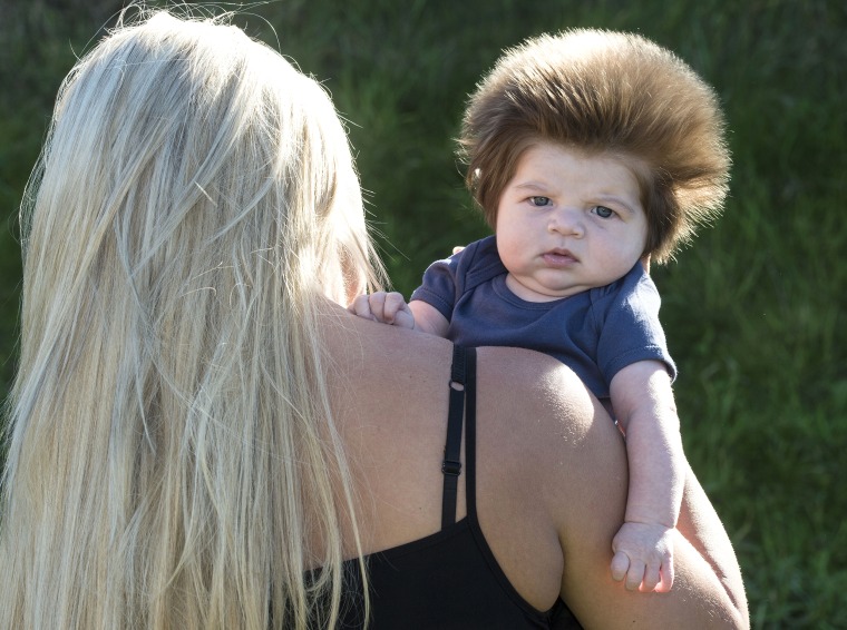 This baby has a huge head of hair