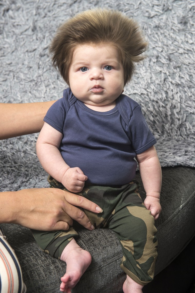 This baby has a huge head of hair