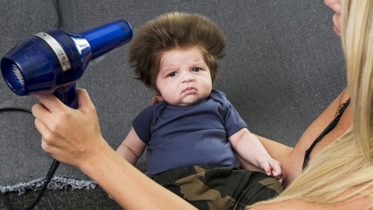 This baby has a huge head of hair