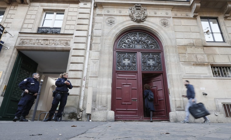 Image: Police stand guard outside the entrance where Kim Kardashian West was staying