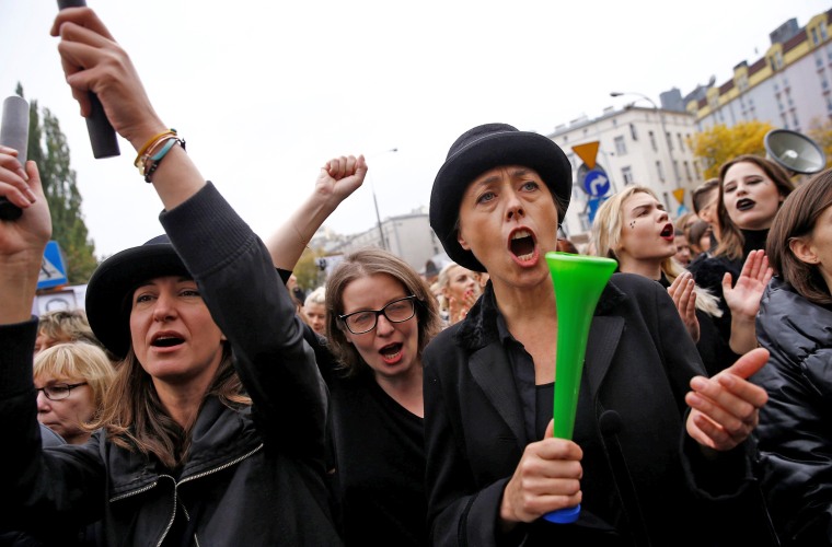 Image: Women shout slogans as they gather in an abortion rights campaigners' demonstration