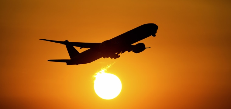 An airplane starts into the sunset from the airport in Frankfurt/Main, Germany, 23 August 2013.