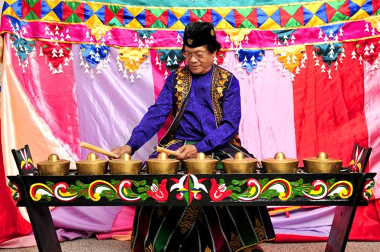 Danongan "Danny" Kalanduyan, a 1995 NEA National Heritage Fellow, playing the Kulintang gongs in his NEA portrait.