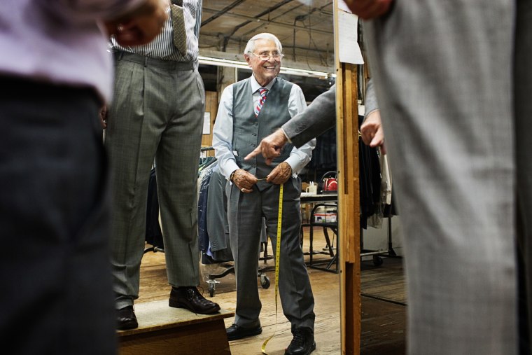 Image: Martin Greenfield measures a customer