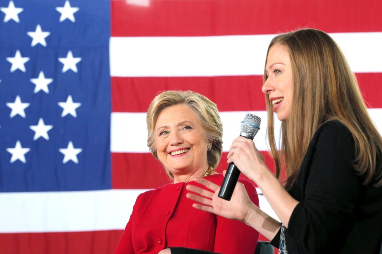 Image: U.S. Democratic presidential nominee Hillary Clinton listens as her daughter Chelsea speaks at a \"Family Town Hall\" campaign stop in Haverford