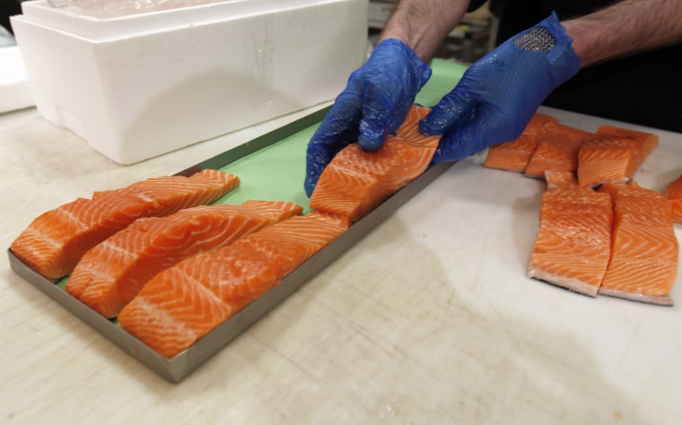 Canadian certified organic farm-raised King Salmon filets are placed on a tray at the Wegmans on April 10, 2015 in Fairfax, Va.