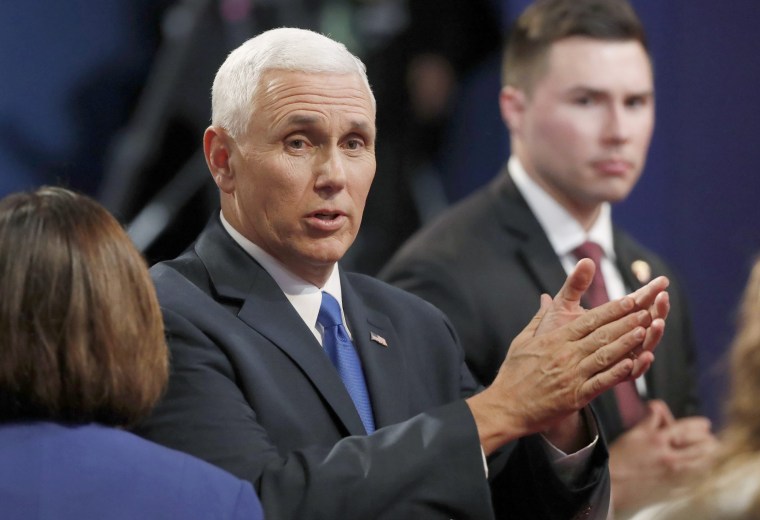 Image: Republican U.S. vice presidential nominee Governor Mike Pence claps as he talks to the audience after the conclusion of the vice presidential debate against Democratic U.S. vice presidential nominee Senator Tim Kaine at Longwood University in Farmv