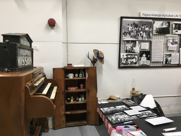 A picture of an FANHS exhibit with the Lighthouse Mission and early Trinity Presbyterian Church on the left and the labor camp exhibit on the right.