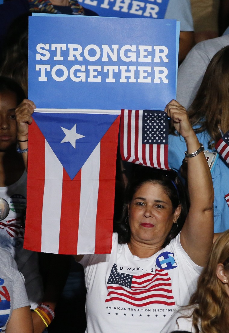 Image: US Democratic presidential candidate Hillary Clinton introduces running mate Senator Tim Kaine