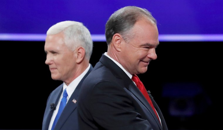 Image: Democratic U.S. vice presidential nominee Senator Tim Kaine and Republican U.S. vice presidential nominee Governor Mike Pence pass each other after the conclusion of their vice presidential debate at Longwood University in Farmville