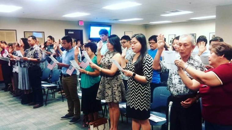 The oath of citizenship is administered at a U.S. Citizenship and Immigration Services swearing-in ceremony in Honolulu, Hawaii, on June 7, 2016.