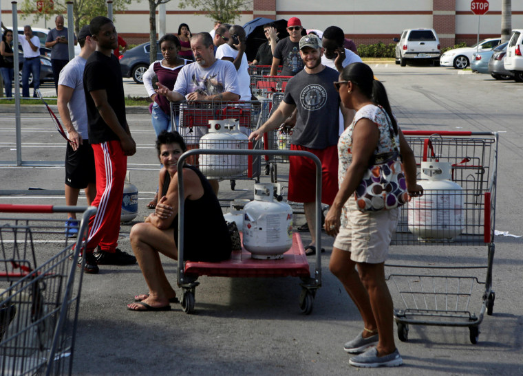 Image: People line up to fill their LP propane gas cylinders in anticipation of Hurricane Matthew, in Coral Springs