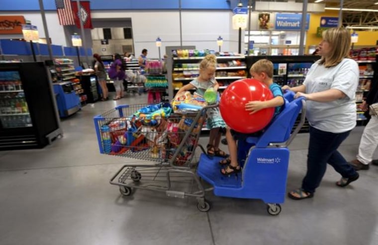 A family shops at the Wal-Mart Supercenter in Springdale