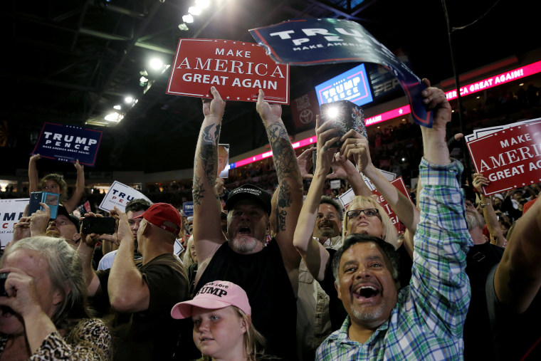 Image: Supporters of Republican presidential nominee Donald Trump cheer at a campaign rally, in Prescott Valley