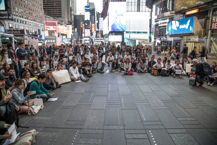 The marchers assembled into smaller groups after the demonstration in New York's Times Square on Wednesday night.